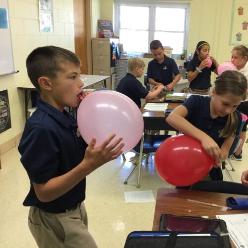 class-playing-with-balloons-image