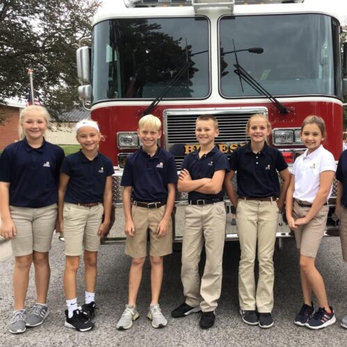 students-in-front-of-firetruck-image